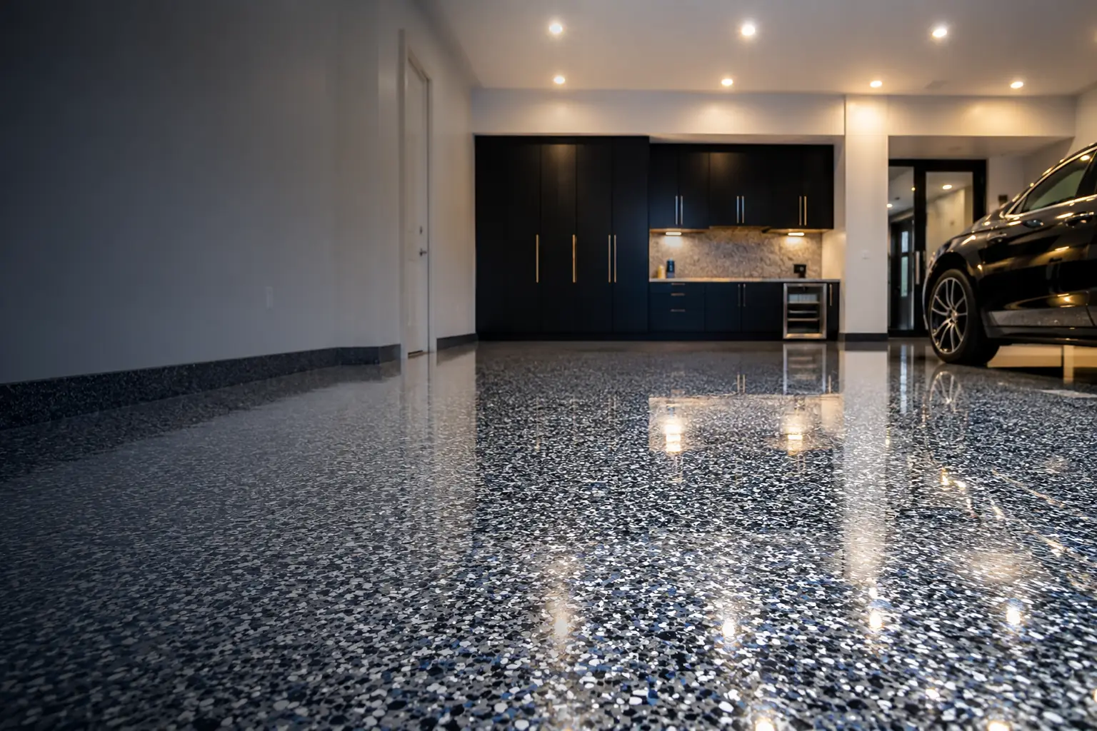 Luxury garage with a premium full-chip polyaspartic epoxy coated floor